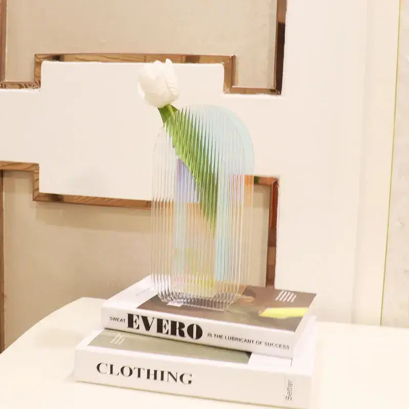 DecorBites™ acrylic flower vase with translucent ribbed design and iridescent sheen holding a white tulip for home office