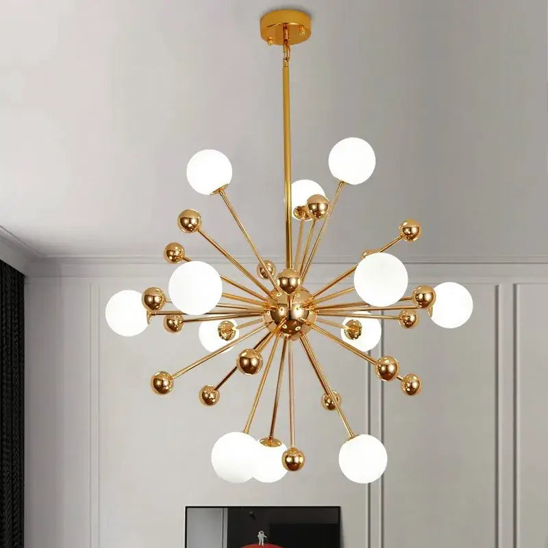 Gold-toned decorbites acrylic molecule chandelier with frosted glass globe bulbs in a dining room starburst design
