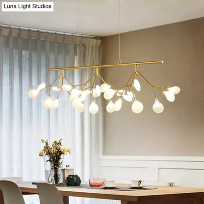 Gold-toned firefly metal pendant with multiple frosted glass globes and adjustable hanging cord for bedroom lighting