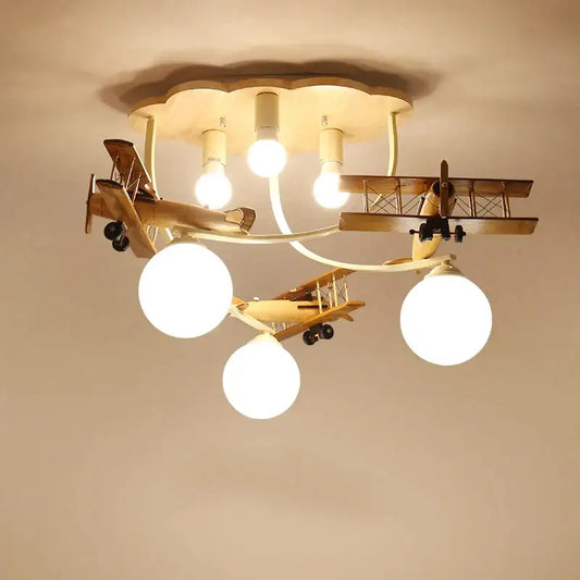Decorbites wooden airplane chandelier light with three spherical bulbs and cloud-shaped base for nursery room ceiling