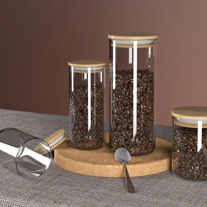 Decorbites™ airtight glass coffee bean storage jars with bamboo lids and white silicone seals on cork board display