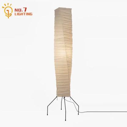 Tall beige decorbites™ akari noguchi floor lamp with minimalist rice paper shade and black metal tripod base for living room