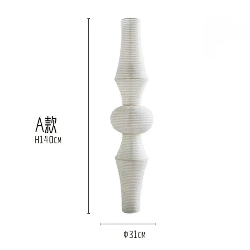 A tall white paper pendant light with vertical ridges and segmented design from decorbites akari noguchi vintage collection