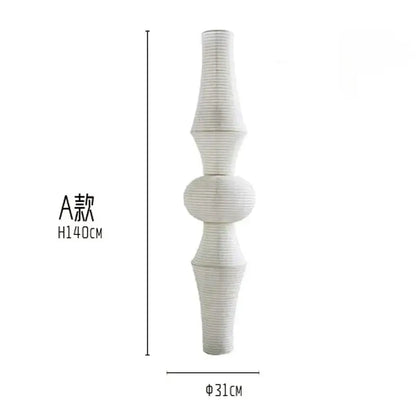 A tall white paper pendant light with vertical ridges and segmented design from decorbites akari noguchi vintage collection