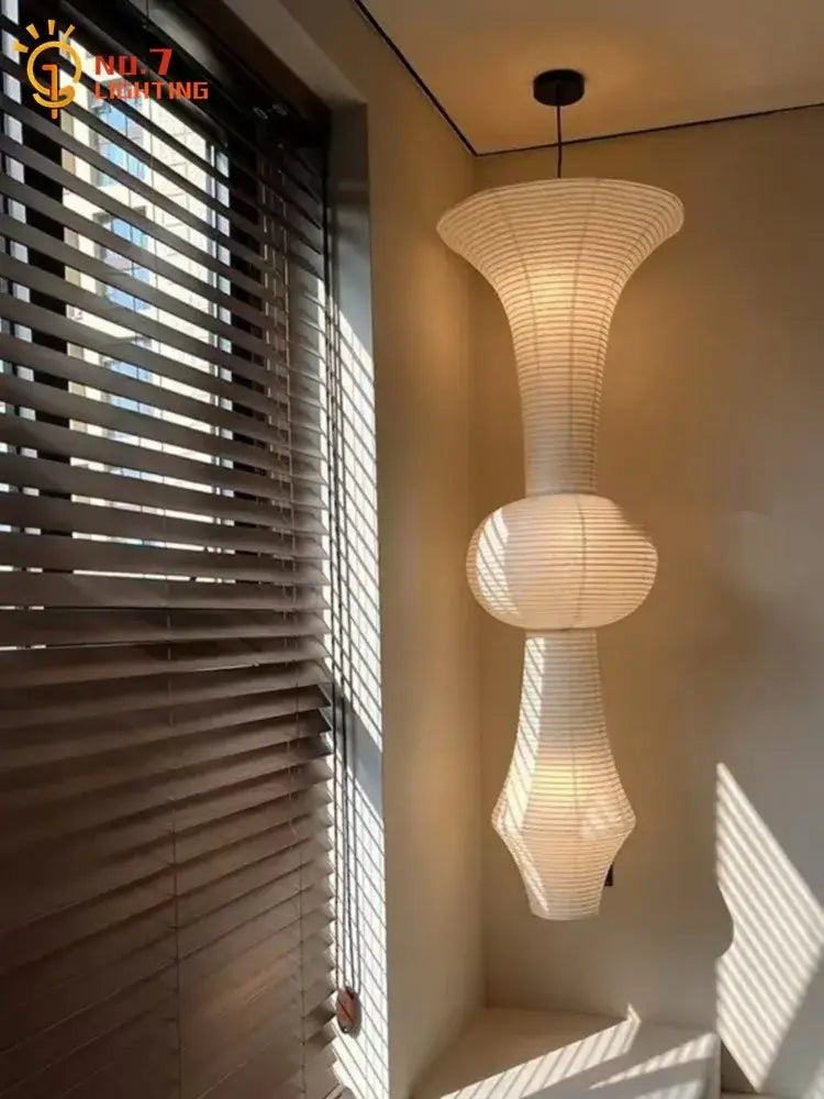 Off-white sculptural tiered pendant light made of paper in decorbites akari noguchi vintage design for bar loft studio