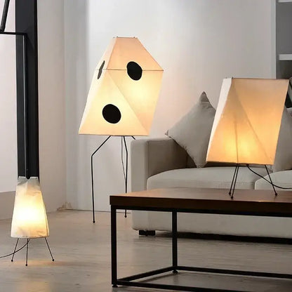 Decorbites akari rice paper floor lamp with black circular cutouts and warm diffused glow for home decor