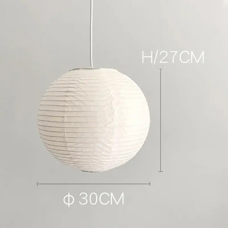 White spherical DecorBites™ akari vintage rice paper pendant light with vertical ridges and hanging cord
