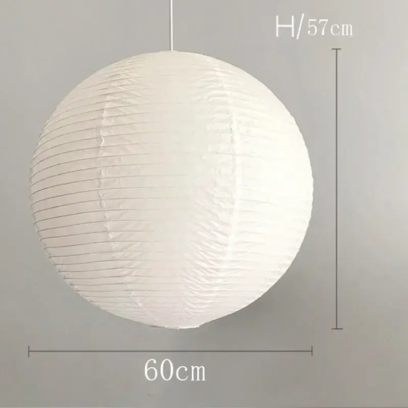 White spherical pendant light with vertical ribbed rice paper texture hanging cord akari vintage rice design