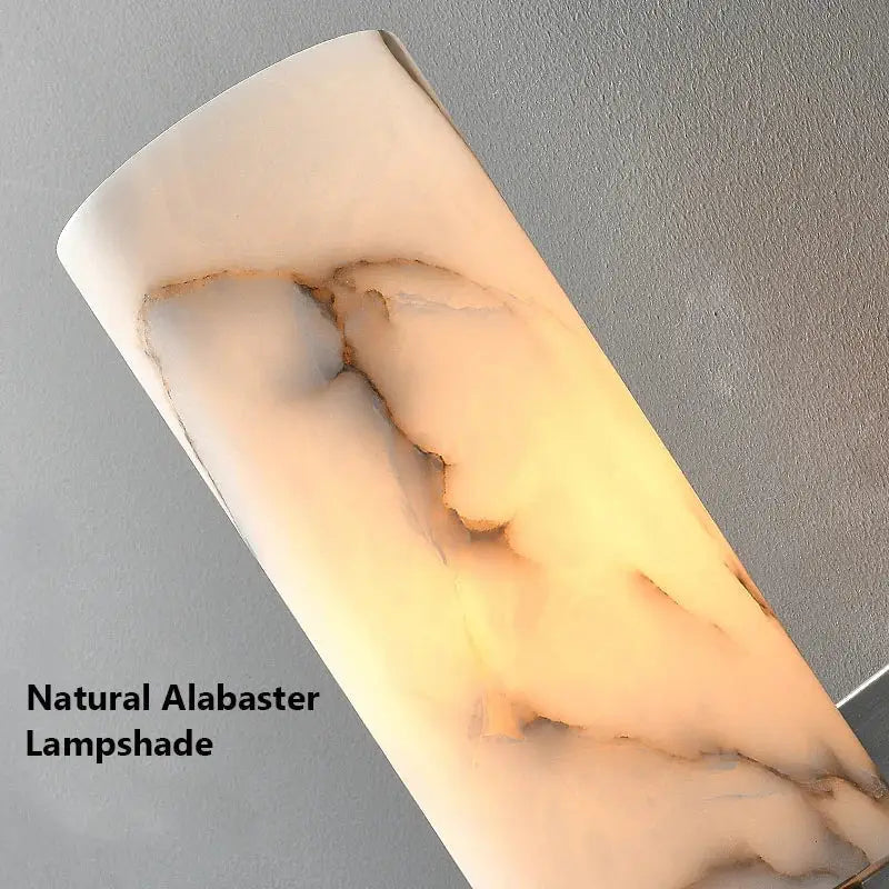 Decorbites alabaster copper wall lamp with curved ivory alabaster shade and amber veining for bedroom living room use