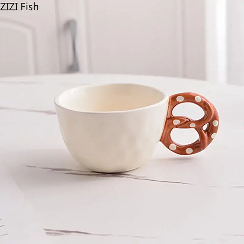 Cream-colored ceramic alkali water biscuit mug with brown pretzel-shaped handle and white polka dots for dining table use