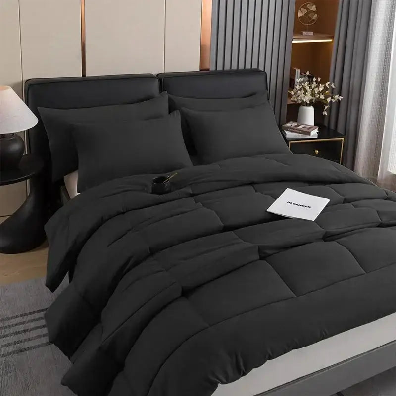 Black DecorBites™ all-season quilted comforter set with plush soft texture and subtle sheen for queen and king beds