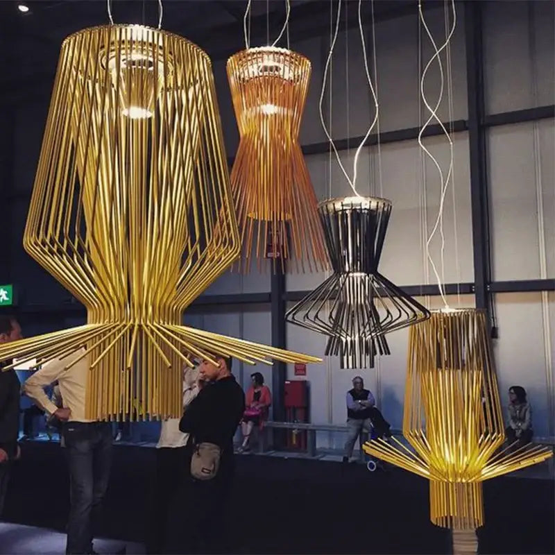 Golden slender bamboo-like pendant lights with geometric design hang from ceiling in decorbites allegro ritmico chandelier
