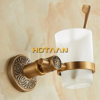DecorBites aluminium single tumbler holder with antique brass finish and frosted white glass cup for cup holder use
