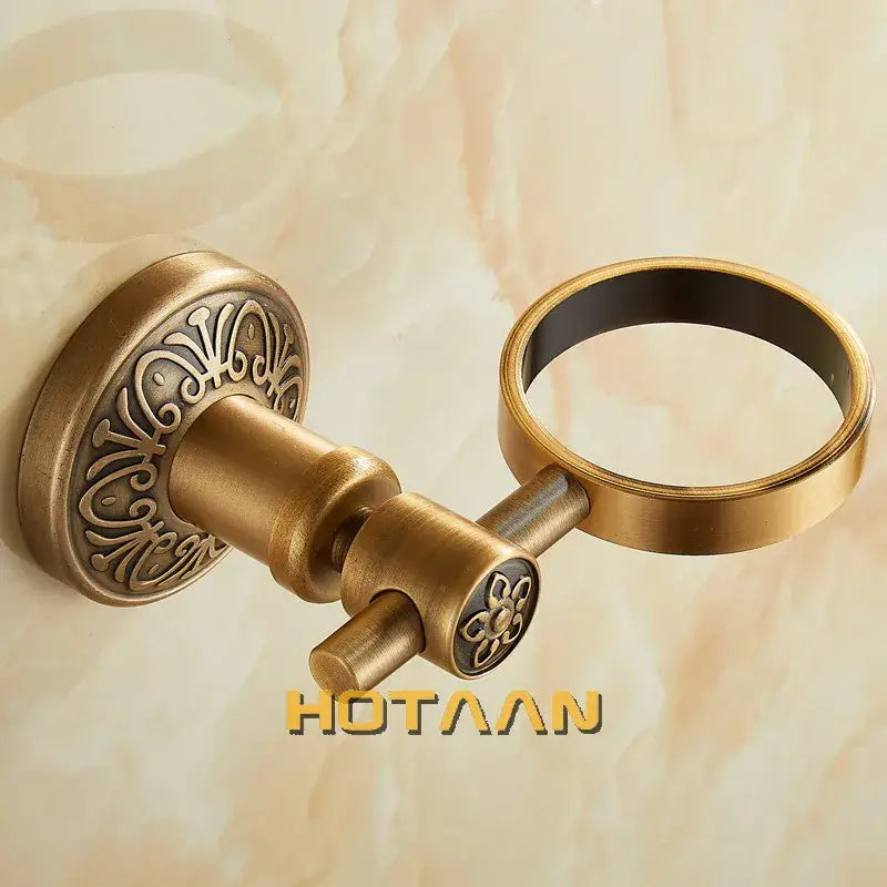 DecorBites™ aluminium single tumbler holder in antique brass finish with ornate floral engraving and circular towel ring, ideal cup holder