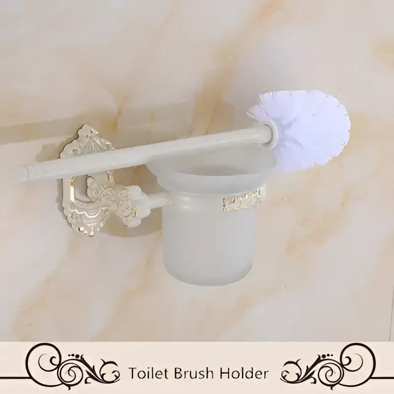 Silver ornate aluminum toilet brush holder with frosted glass cup and white bristle brush in decorbites bath hardware set