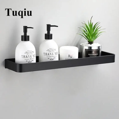 Decorbites™ black matte aluminum bathroom corner shelf wall mounted holding essentials and a small potted plant