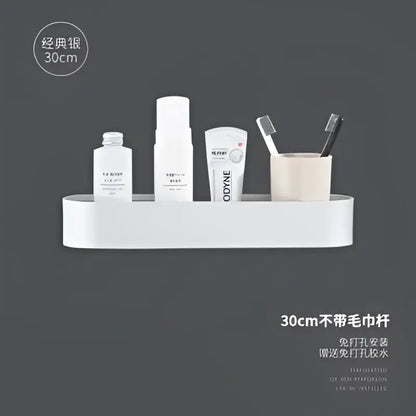 White aluminum bathroom shelf with towel bar mounted on wall holding toiletries for bath and shower organization