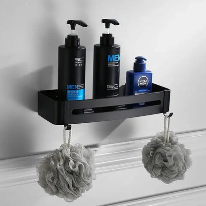 Black aluminum wall-mounted shower caddy holding bottles and loofahs in decorbites bathroom hardware set
