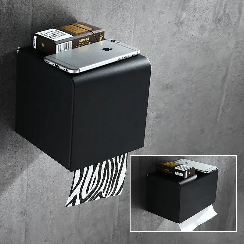 Black matte aluminum decorbites™ wall-mounted toilet paper rack with zebra-striped roll and paper rack stand design