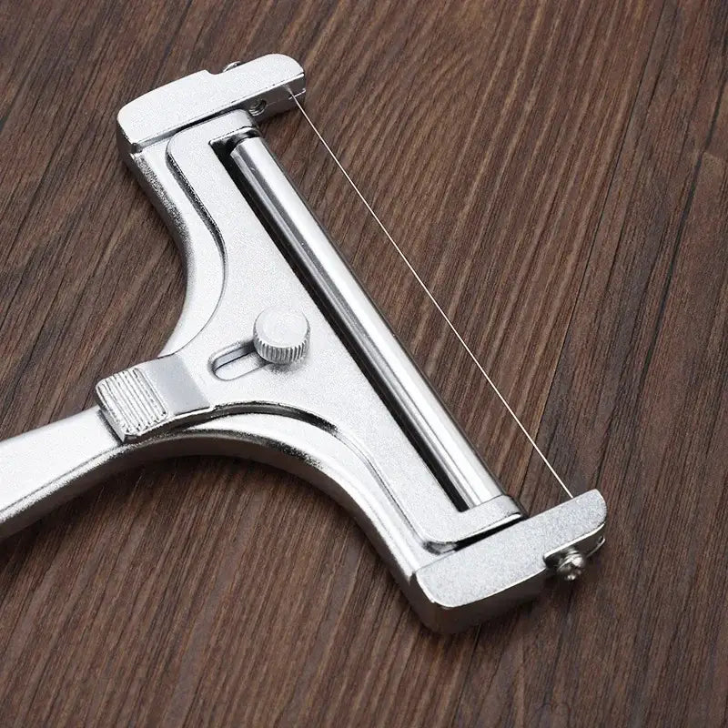 Silver aluminum cheese butter slicer with fine wire blade and adjustable tension knob for precise cutting