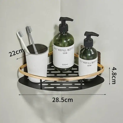 Modern aluminum corner bathroom shelf with black metal base gold-toned rim holding toothbrushes and green pump bottles