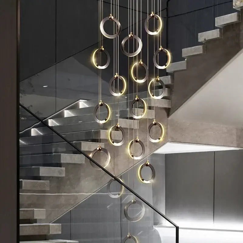 Modern minimalist decorbites™ aluminum led chandelier with interlocking silver and gold rings for luxury staircase lighting