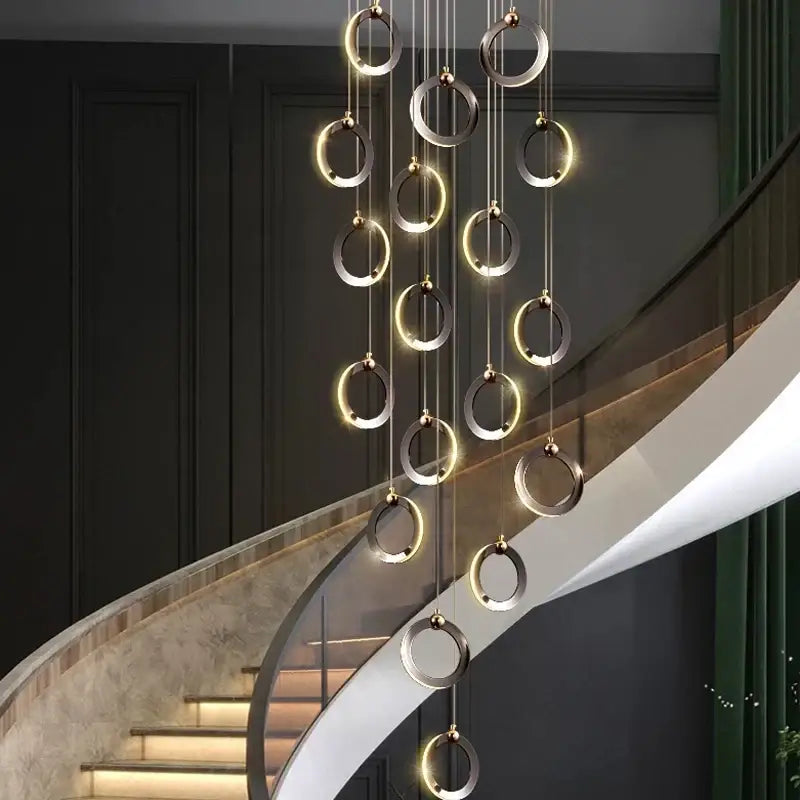 DecorBites aluminum led chandelier with polished metallic rings emitting warm light ideal for staircase and attic lighting