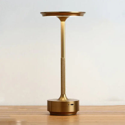 Gold-finished aluminum led desk lamp with sleek modern design textured grip circular base and usb port for living room use