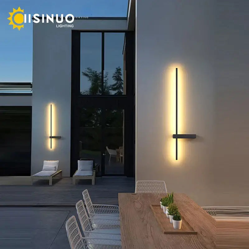 Modern black aluminum outdoor wall sconce with minimalist vertical design and warm ambient lighting for porch and patio