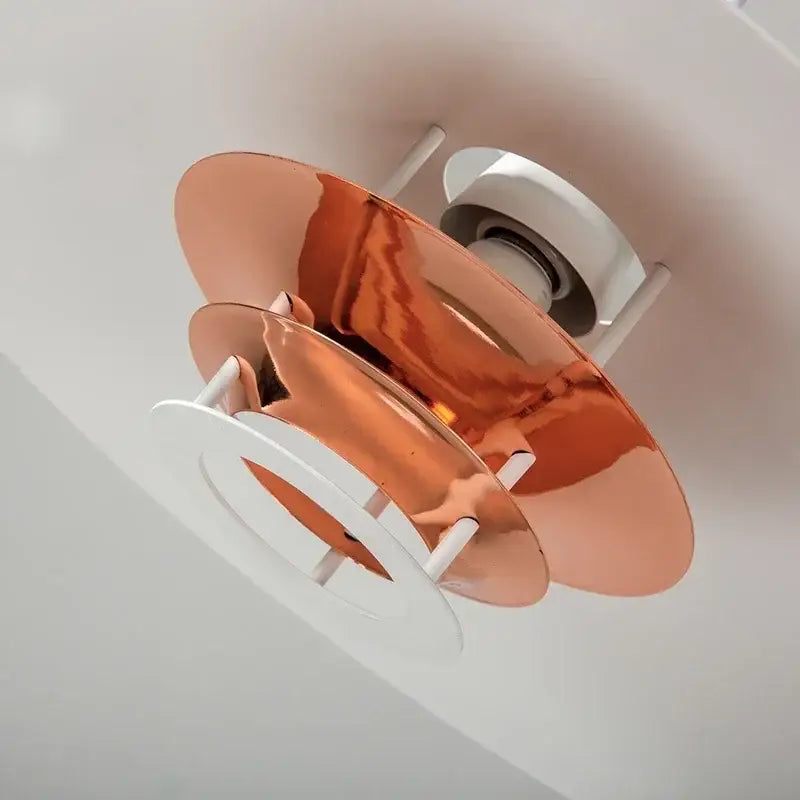 Copper-colored layered disc-shaped decorbites aluminum pendant light with white base for kitchen island pendant lights