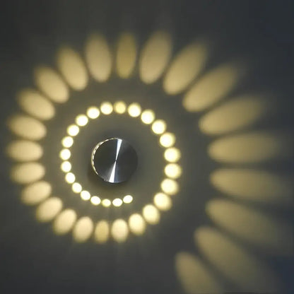 Decorbites aluminum spiral led wall lamp with sleek metallic center and warm yellow concentric led rings for living room