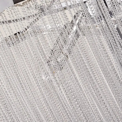 Silver metallic chain curtain with interlocking links creating a textured pattern in decorbites aluminum tassel chandelier