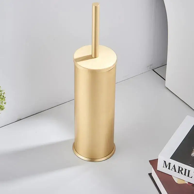 Decorbites™ aluminum toilet brush holder set in brushed gold features a sleek metallic cylindrical brush holder and handle
