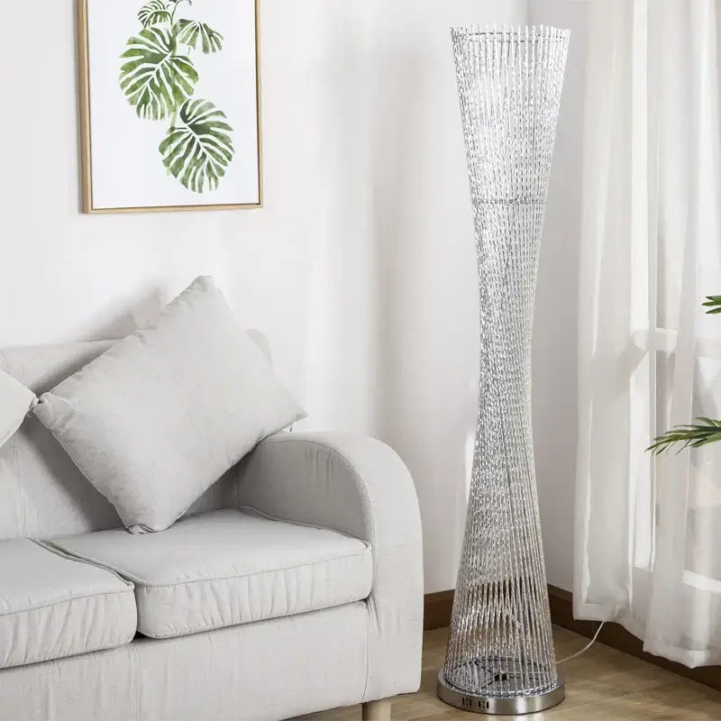 Silver beaded DecorBites™ aluminum tower floor lamp with tall slender design and metallic base for living room decor