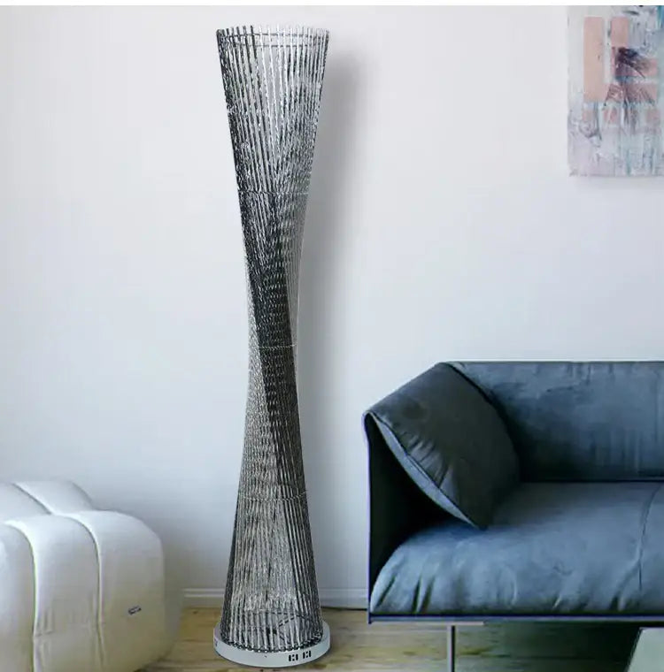 Decorbites aluminum tower floor lamp with twisted metallic mesh design and silver finish for modern living room decor