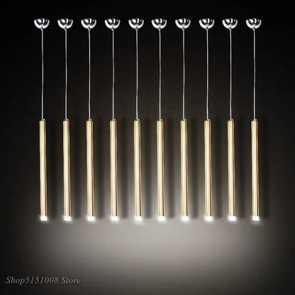 Ten modern gold-toned aluminum tube pendant lights with chrome tops and warm glow by decorbites pendant light for dining room