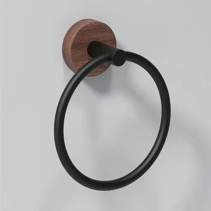 Decorbites aluminum and walnut towel ring with black matte finish and circular design mounted on round wooden base