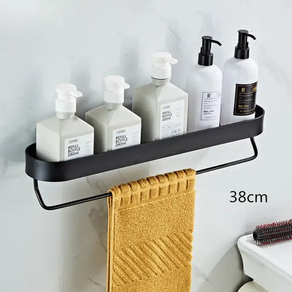 DecorBites™ black metal bathroom shelf with towel bar and corner storage shelf holding towel and pump bottles