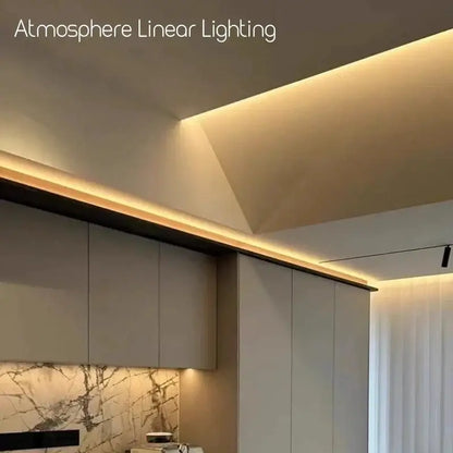 Decorbites™ aluminum profile led strip lights in warm tone mounted on ceiling edge casting soft glow on cabinetry
