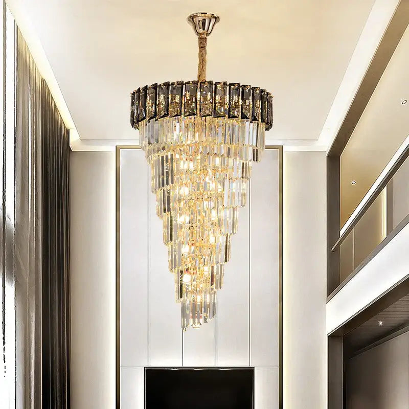 Decorbites amber crystal chandelier with gold-toned frame and cascading clear dark crystals for luxurious spaces