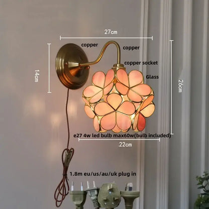 Copper-finished DecorBites amber flower glass wall sconce with pink and peach flower-shaped panels for living room