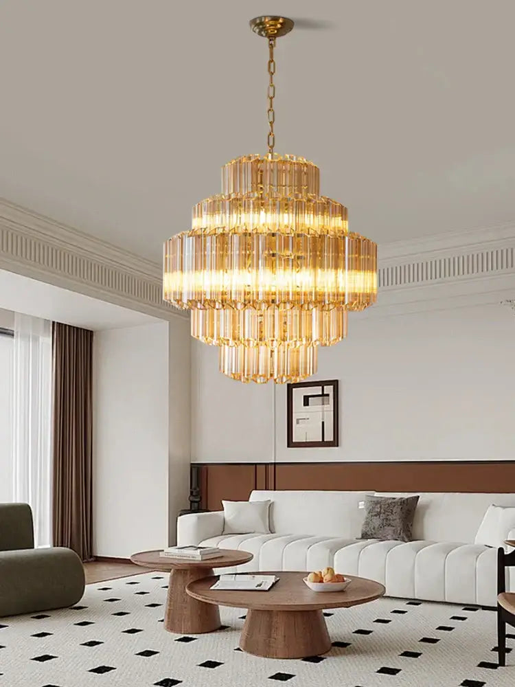 Golden tiered amber glass ceiling chandelier with crystal rods and brass chain for elegant vintage lighting