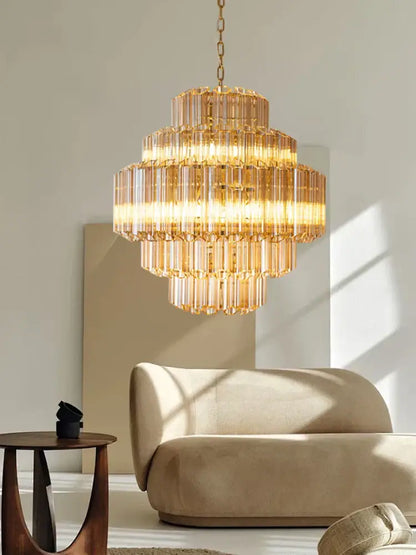 Golden tiered glass ceiling chandelier with amber glass rods and brass chain from DecorBites amber glass ceiling collection