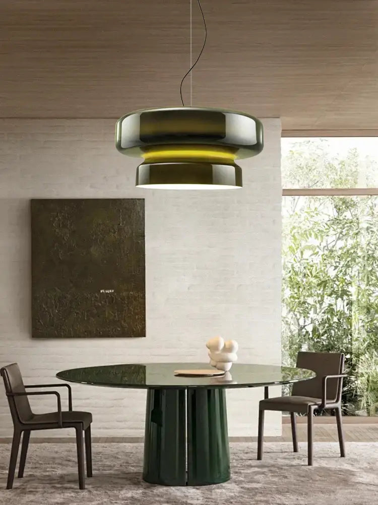 A sleek modern pendant light with layered dark green and metallic silver tones for decorbites amber glass ceiling pendant lights