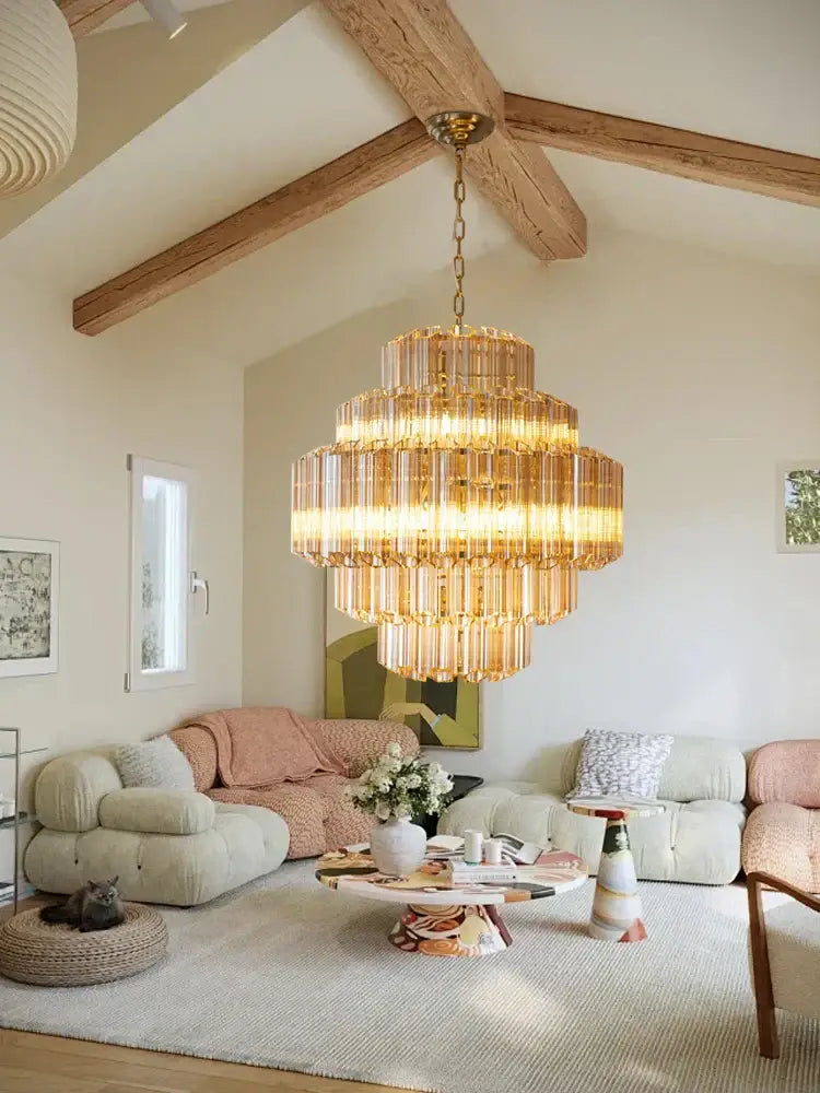Golden tiered amber glass chandelier with crystal rods hanging from a brass chain for living and dining rooms