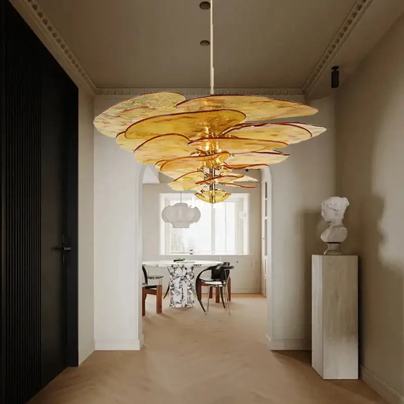 Golden layered amber glass chandelier with petal-like design for luxury vintage living space in duplex villa