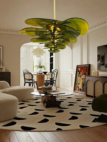 Decorbites amber glass chandelier featuring a striking green glass design with layered petal shades for living space lighting