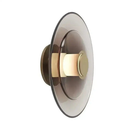 Modern wall sconce with layered smoked glass disc and brass accents from decorbites amber glass disc wall lamp collection