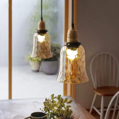 Decorbites amber glass industrial pendant lights with textured golden glass and brass fixtures for dining and bedroom use