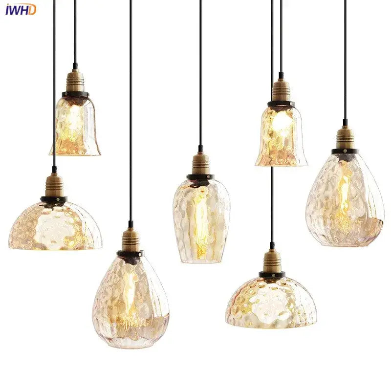 Set of seven amber glass industrial pendant lights with textured design and brass fixtures for vintage decor